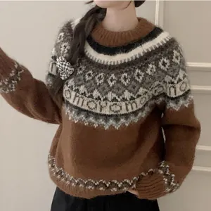 Detailed view of a brown Fair Isle cashmere sweater for women with intricate knit patterns