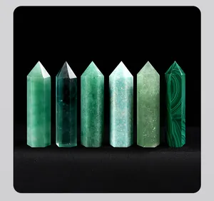 A detailed macro view of six natural green crystal prisms in varying textures and shades