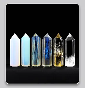 Detailed view of six natural hexagonal crystal pillars with unique textures on black.