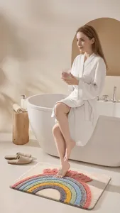 Tufted rainbow bathroom mat shown in a modern home spa setting with model's feet