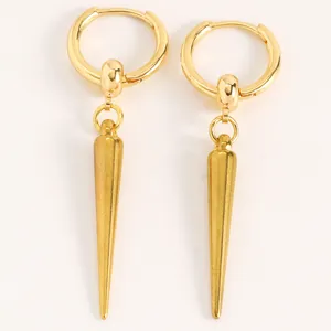 Macro view of gold punk gothic spike hoop earrings for a rock aesthetic