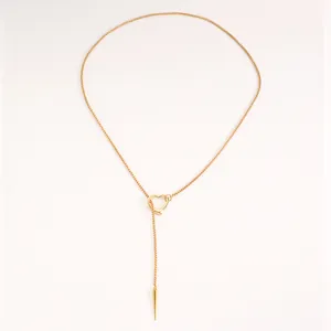 Elegant gothic punk style gold heart lariat necklace with a sharp spike pendant detail