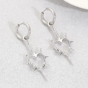 Punk gothic style silver heart hoop earrings with spiked rivet details for women
