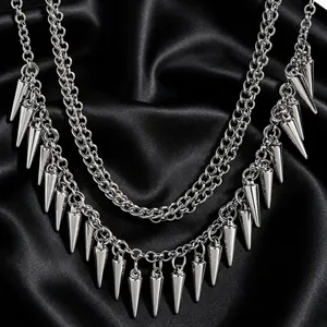 Detailed macro view of polished silver metal cone spikes on a gothic punk accessory