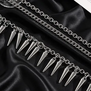 Detail shot of silver gothic punk metal chains and sharp spike rivets jewelry