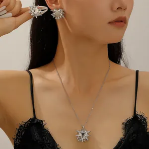 Close-up view of a gothic punk silver rivet spiked necklace and earrings jewelry set