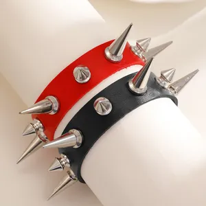 Punk rock style leather bracelets with silver metal spikes in red and black colors.