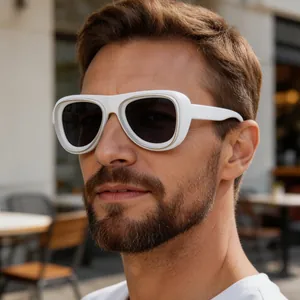 Close-up detail of stylish white thick-frame aviator sunglasses for men outdoors