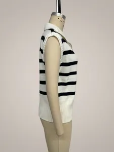Side view of a black and white striped knitted vest with zipper on a studio mannequin