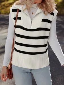 Detail view of a striped knit vest with a silver half-zip collar and ribbed texture.