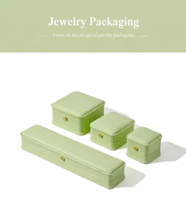 Mint green jewelry box set featuring elegant golden crown buckles in various sizes.