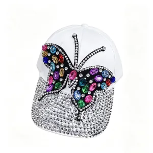 Elegant white baseball cap with colorful rhinestone butterfly design and sparkly brim