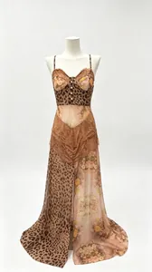 Detailed view of leopard and floral print chiffon maxi dress with lace trim.