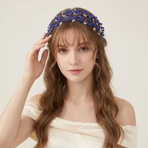 Vintage bridal headband featuring dark blue crystals and golden hollow leaves design