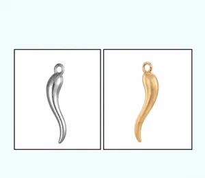 Detailed view of curved zinc alloy chili pepper charms in silver and gold finishes
