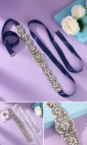Close-up detail of luxury bridal wedding belt with sparkling rhinestones and navy blue ribbon