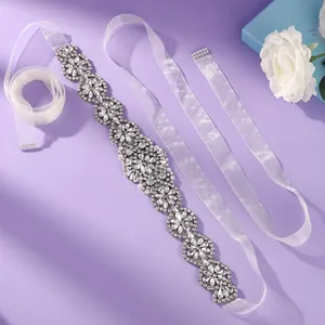 Luxury rhinestone bridal belt with elegant crystal floral pattern on white sash ribbon