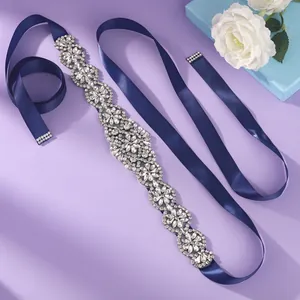 Luxury navy blue bridal sash with intricate rhinestone flower detailing for wedding gown