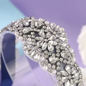 Luxury bridal belt featuring sparkling crystals and white pearls on elegant lavender fabric
