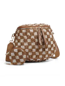 Close-up detail of the distressed fringe checkerboard pattern on the brown bum bag