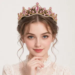 Close-up view of an elegant gold princess tiara with pink crystals on a female model