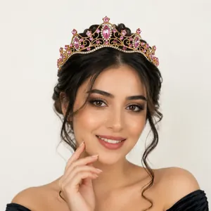 Elegant gold bridal crown with pink crystals worn by a model for weddings and parties