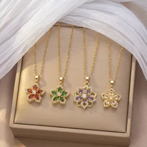 Detailed view of four rotatable zircon flower necklaces in red green purple and clear