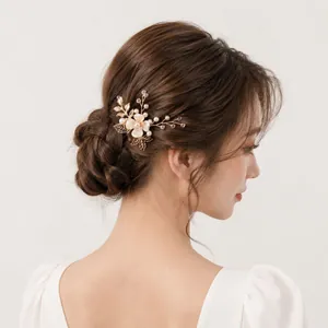 Elegant handmade gold flower hair pin with pearls on Asian model in bun