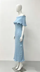 Light blue off-the-shoulder knitted maxi dress featuring delicate ruffle hem and collar details