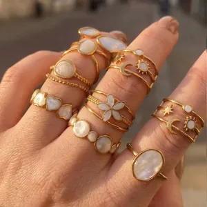 Collection of elegant gold stainless steel rings with shell flower and heart motifs