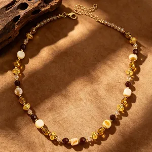 Macro view of Maillard vintage tiger eye beaded necklace with warm brown tones.