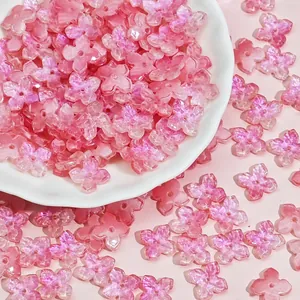 Close-up of pink 10mm shimmering glass four-petal flower beads for DIY jewelry