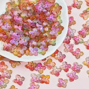 Close-up of 10mm colorful 4-petal glass flower beads for DIY jewelry making projects.
