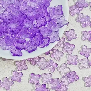 Close-up of 10mm purple translucent four-petal glass beads for DIY jewelry crafts