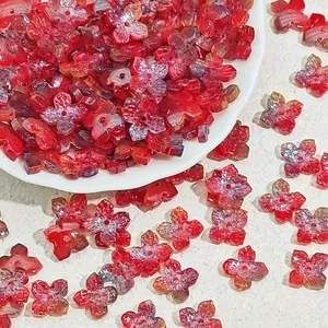 Close-up view of 10mm red glass flower beads for DIY handmade jewelry crafting projects