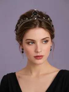 Elegant model wearing a vintage dark gothic baroque crown with intricate black gemstones
