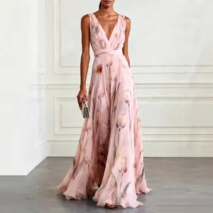 Elegant pink floral print V-neck maxi evening gown on a model in a studio setting