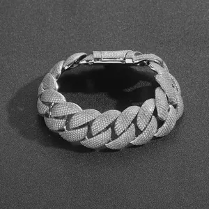 Detailed view of 22mm iced out silver Cuban link chain with simulated diamonds