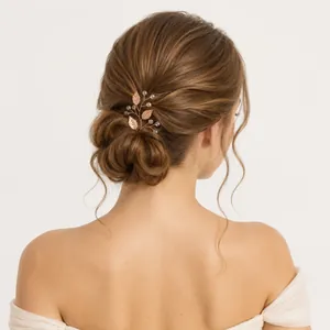 Hand-crafted metallic leaf bridal hair pin with beads for elegant wedding hairstyles.