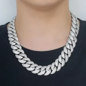 Macro view of 22mm silver iced out Cuban link necklace showing detailed stone setting.