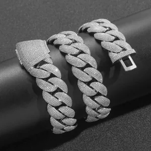 Close-up detail of 22mm iced-out Cuban link chain with sparkling stones and secure clasp
