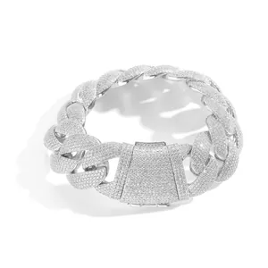 Detailed view of a 22mm iced-out silver Cuban link necklace with heavy stone setting.