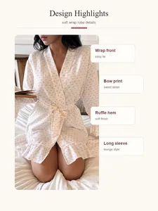 Detail view of cloud cotton robe with bow print, ruffle hem, and wrap front design.
