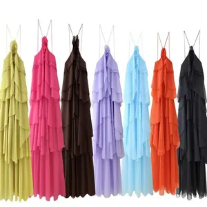 Multi-color collection of tiered halter maxi dresses with floral neck detail