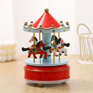 Classic red and blue wooden carousel music box featuring a mechanical clockwork movement
