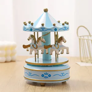 Classic light blue and white wooden carousel music box with elegant golden accents
