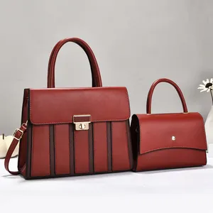 Elegant burgundy top-handle satchel and flap crossbody bag set with textured finish