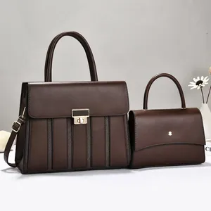Elegant set of dark brown leather top handle bags featuring gold hardware detailing
