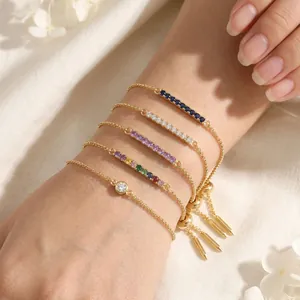 Detailed view of adjustable gold-plated bracelets with vibrant cubic zirconia stones.