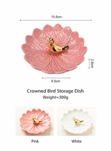 Plateau à bijoux en céramique avec petit oiseau doré et motif de feuille